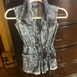 This is a used well worn short jumpsuit with a belt